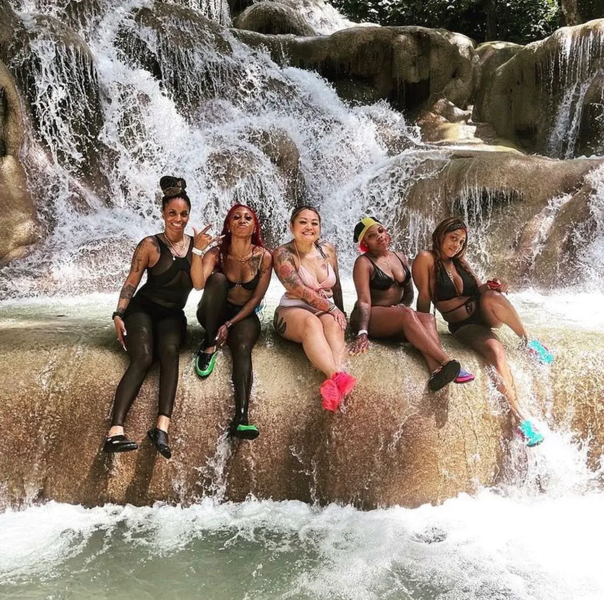 Guests seated beside the cascades at Dunn's River Falls